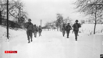 These men are part of the 2nd Infantry Regiment, 5th Infantry Division, that was pinned down for a day and a half before American tanks reached and relieved them near Diekirch, Luxembourg.