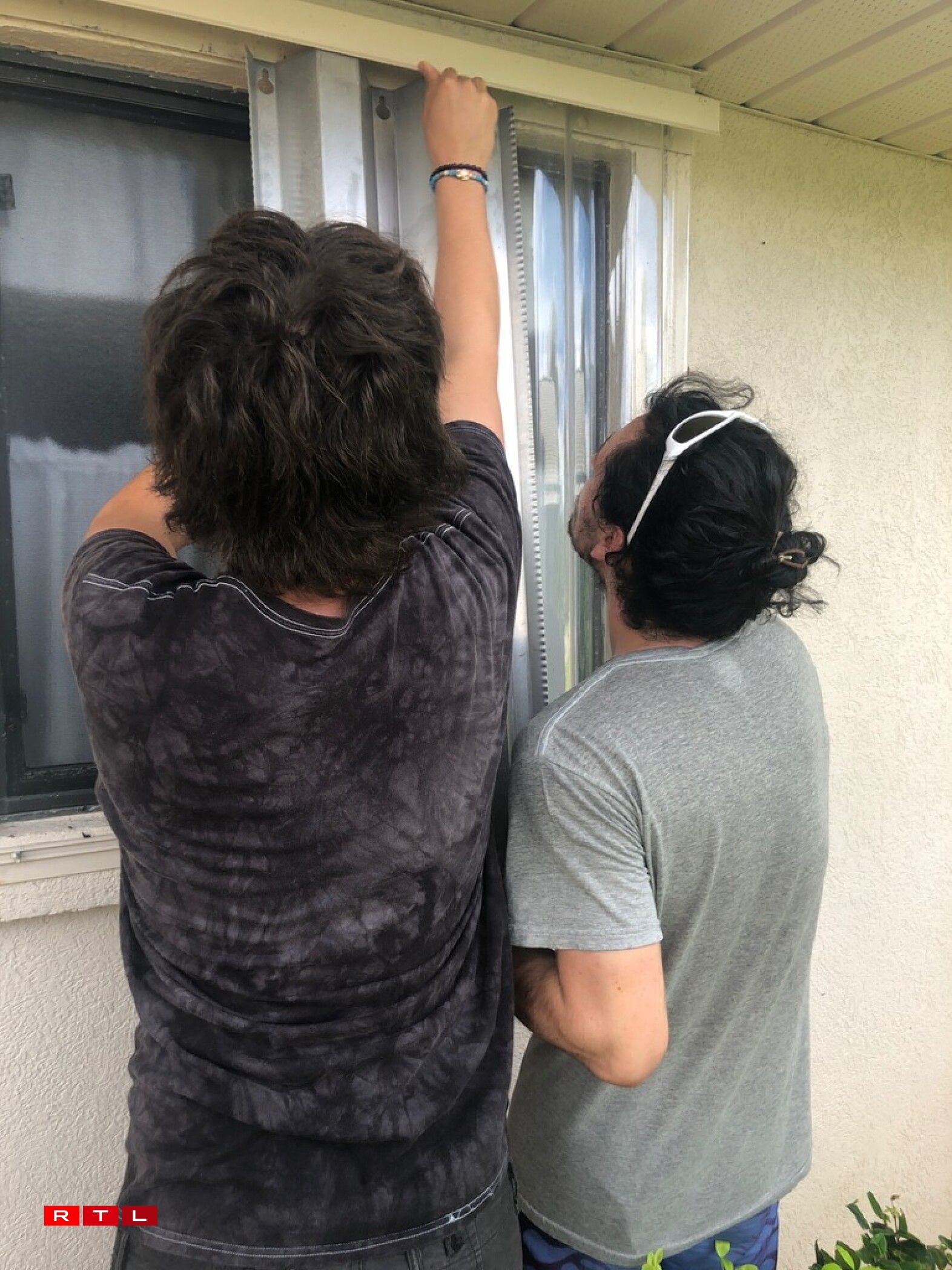 Wendy's sons preparing for the hurricane.