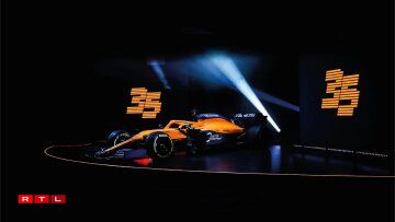 MCLaren F1: Den MCL35 fält souwuel duerch déi méi schmuel Nues an duerch liicht Faarf-Verännerungen op. Hannen ass den Auto méi blo, dogéint ass de Rank ronderëm de Cockpit elo just nach orange an net méi mat schwaarzem Effekt.