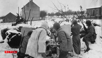 The crew of a three-inch gun covers a front line road on which G-2 has reported 20 German tanks to be advancing. 94th Division sector, junction of France, Germany and Luxembourg. 19 January, 1945.
