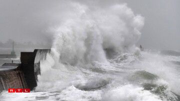 Waves hit a jetty in Plobannalec-Lesconil, western Franceon February 9, 2020 as Storm Ciara sweeps across western Europe. Britain and Ireland hunkered down for a powerful storm expected to disrupt air, rail and sea links, cancel sports events, cut electrical power and damage property. With howling winds and driving rain, forecasters said Ciara would also hit France, Belgium, the Netherlands, Switzerland and Germany.