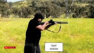 TOPSHOT - This handout photo from a court exhibit released by the NSW Courts as part of the police facts sheet on December 22, 2025 shows a frame grab taken from a video recorded in late October 2025 of Sajid Akram allegedly firing a shotgun and moving in a tactical manner in a countryside location, suspected to be in New South Wales.
