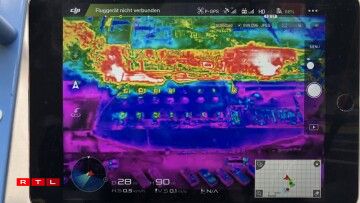 The CGDIS drone shows two concentrated fire spots within the site.
