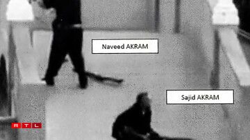 This handout photo from a court exhibit released by the NSW Courts as part of the police facts sheet on December 22, 2025 shows Sajid and Naveed Akram, armed with three firearms, allegedly shooting towards the crowd gathered within Archer Park at Bondi Beach in Sydney on December 14, 2025.