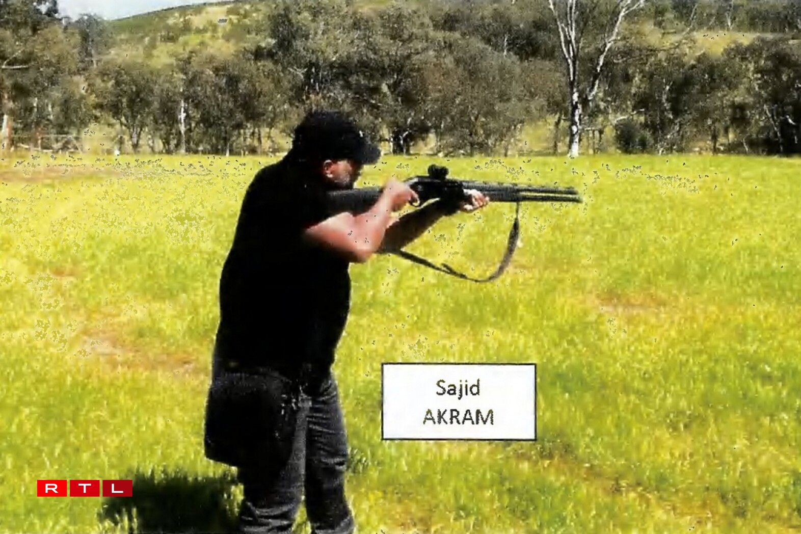 TOPSHOT - This handout photo from a court exhibit released by the NSW Courts as part of the police facts sheet on December 22, 2025 shows a frame grab taken from a video recorded in late October 2025 of Sajid Akram allegedly firing a shotgun and moving in a tactical manner in a countryside location, suspected to be in New South Wales.