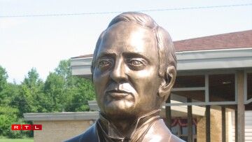 Bronze bust of Dr. Bernard J. Cigrand sculpted by Georges Calteux