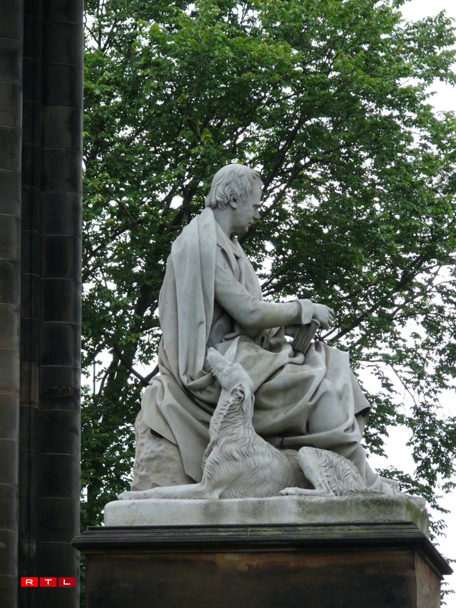 Maida the dog, seen at the side of the sculpture of Sir Walter Scott. The Scott Monument is another of Edinburgh's most prominent buildings.