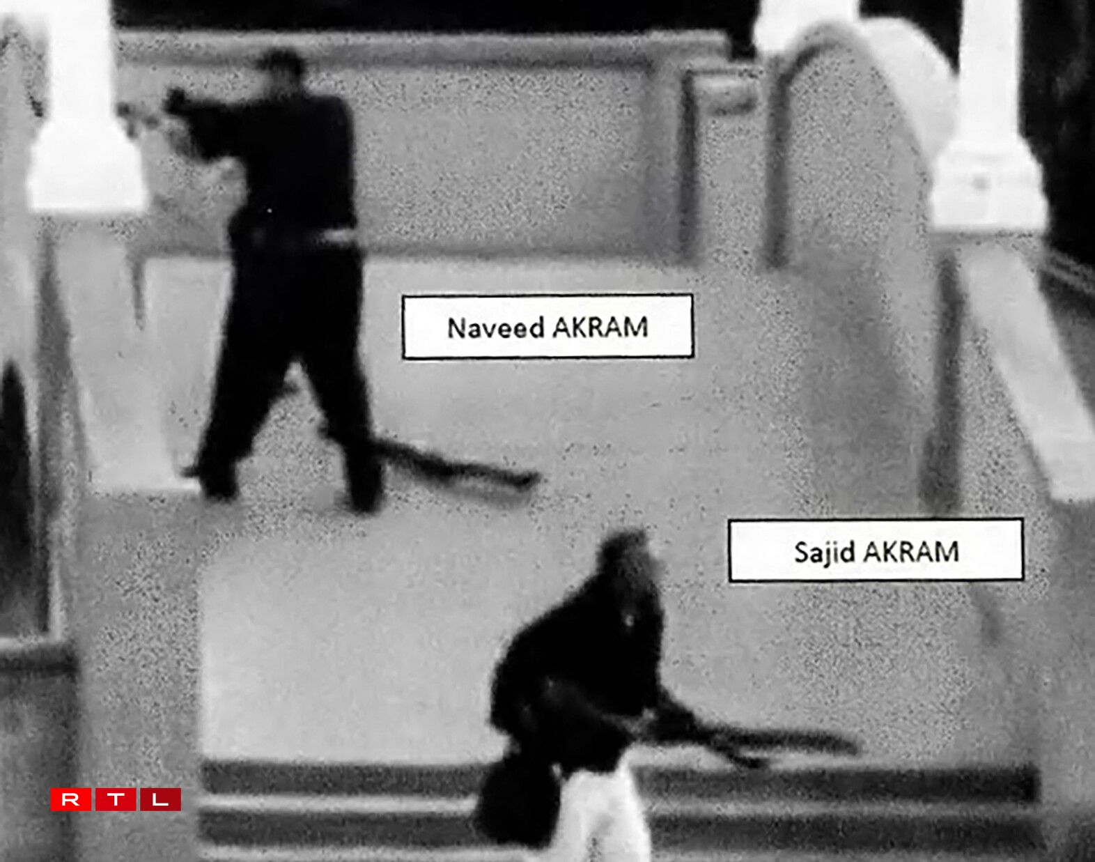 This handout photo from a court exhibit released by the NSW Courts as part of the police facts sheet on December 22, 2025 shows Sajid and Naveed Akram, armed with three firearms, allegedly shooting towards the crowd gathered within Archer Park at Bondi Beach in Sydney on December 14, 2025.