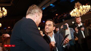 Tel un sprinteur qui passe la ligne, Max Hahn, devenu ministre de la Famille en juin, exulte. Xavier Bettel (de dos) sait que son parti sort renforcé de dix années au pouvoir. Le DP gagne deux sièges au parlement et reste un partenaire de coalition plus crédible que jamais avec ses 14 sièges.