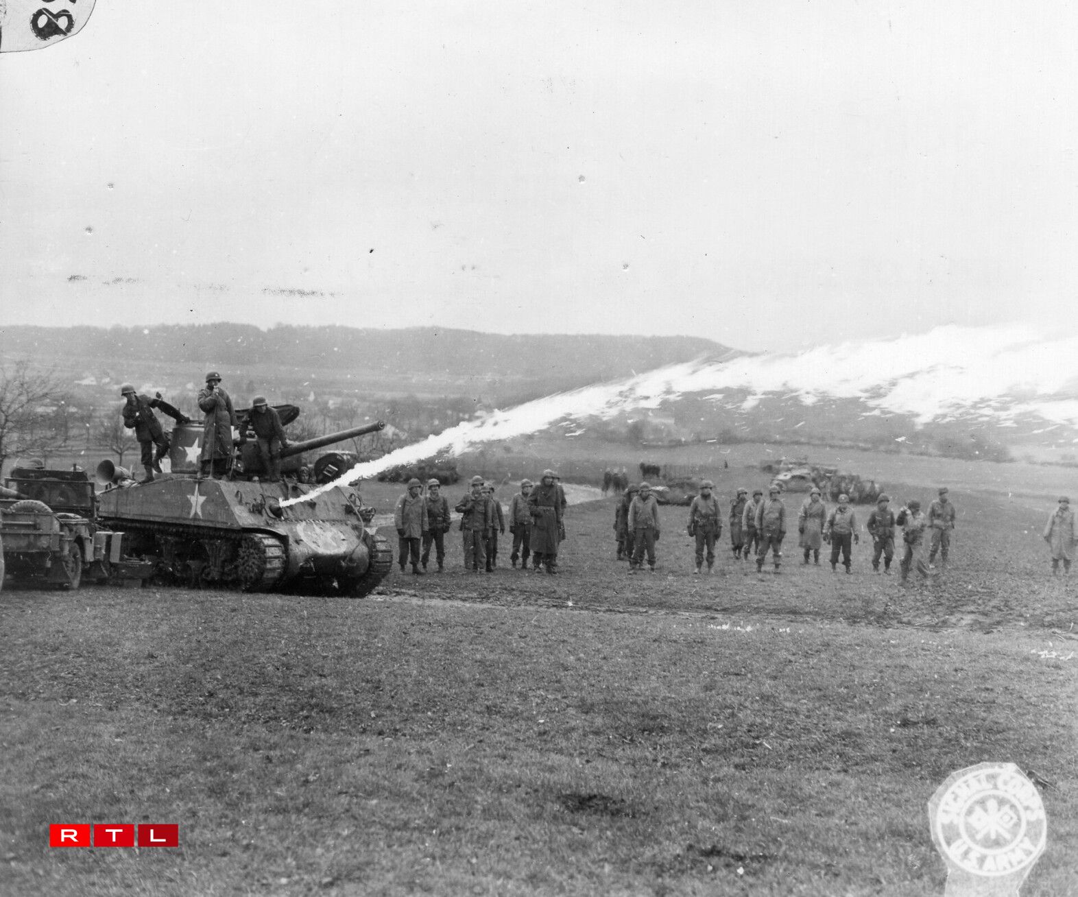 Infantry officers watch a demonstration of a new flamethrower near Mutford, Luxembourg.