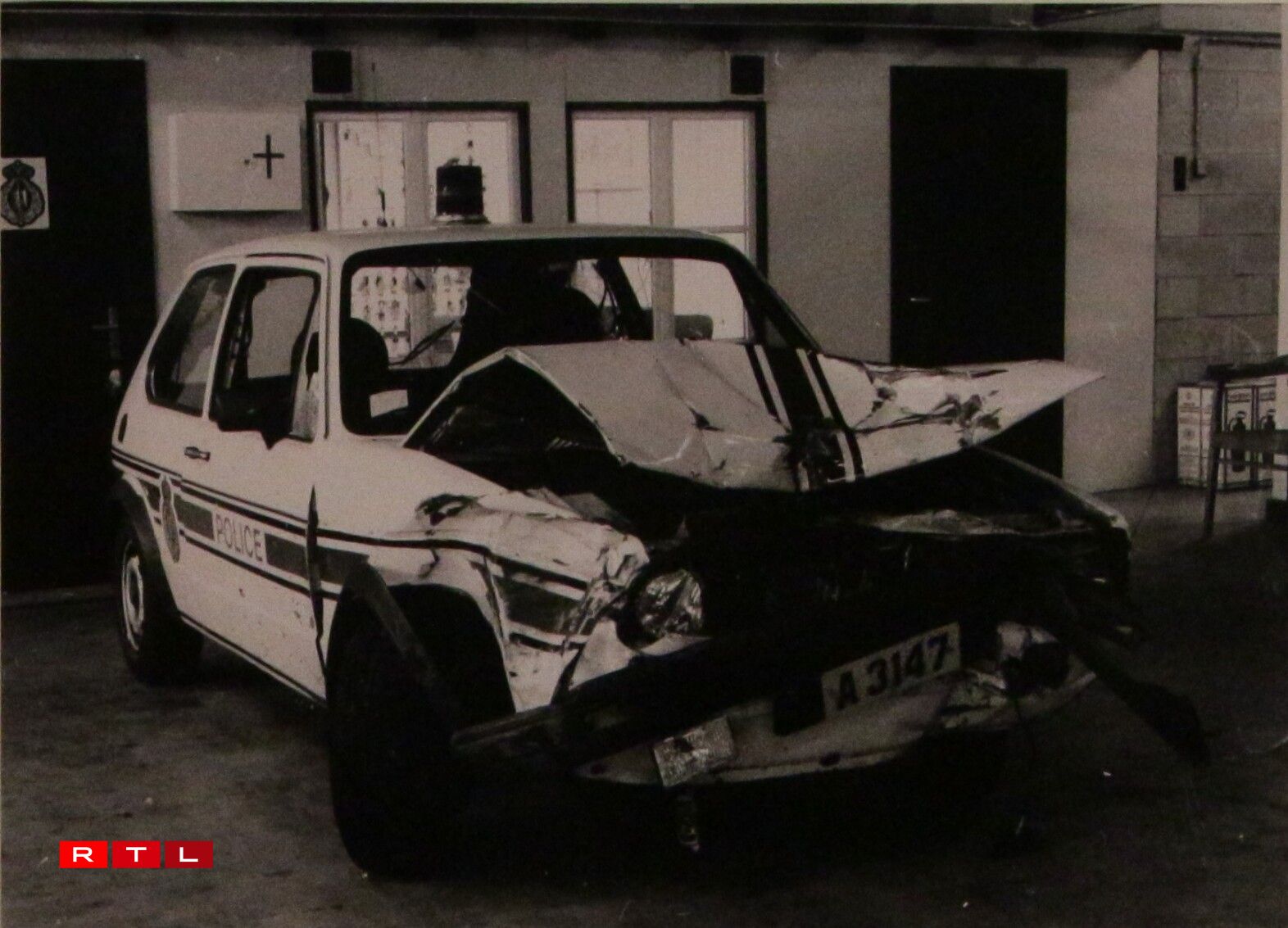 The gang continued their escape in this police vehicle, which crashed into the tractor.