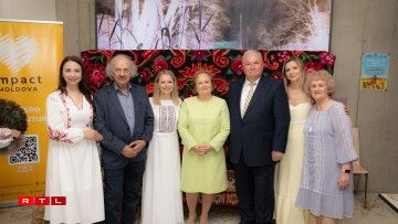 Moldovan poet Vasile Romanciuc with his wife, alongside the Moldovan Ambassador and Impact Moldova team members.